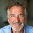 Headshot of Mike B., a confident man in his early 50s.